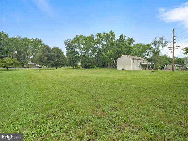 a view of a big yard with a house