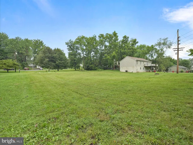a view of a big yard with a house