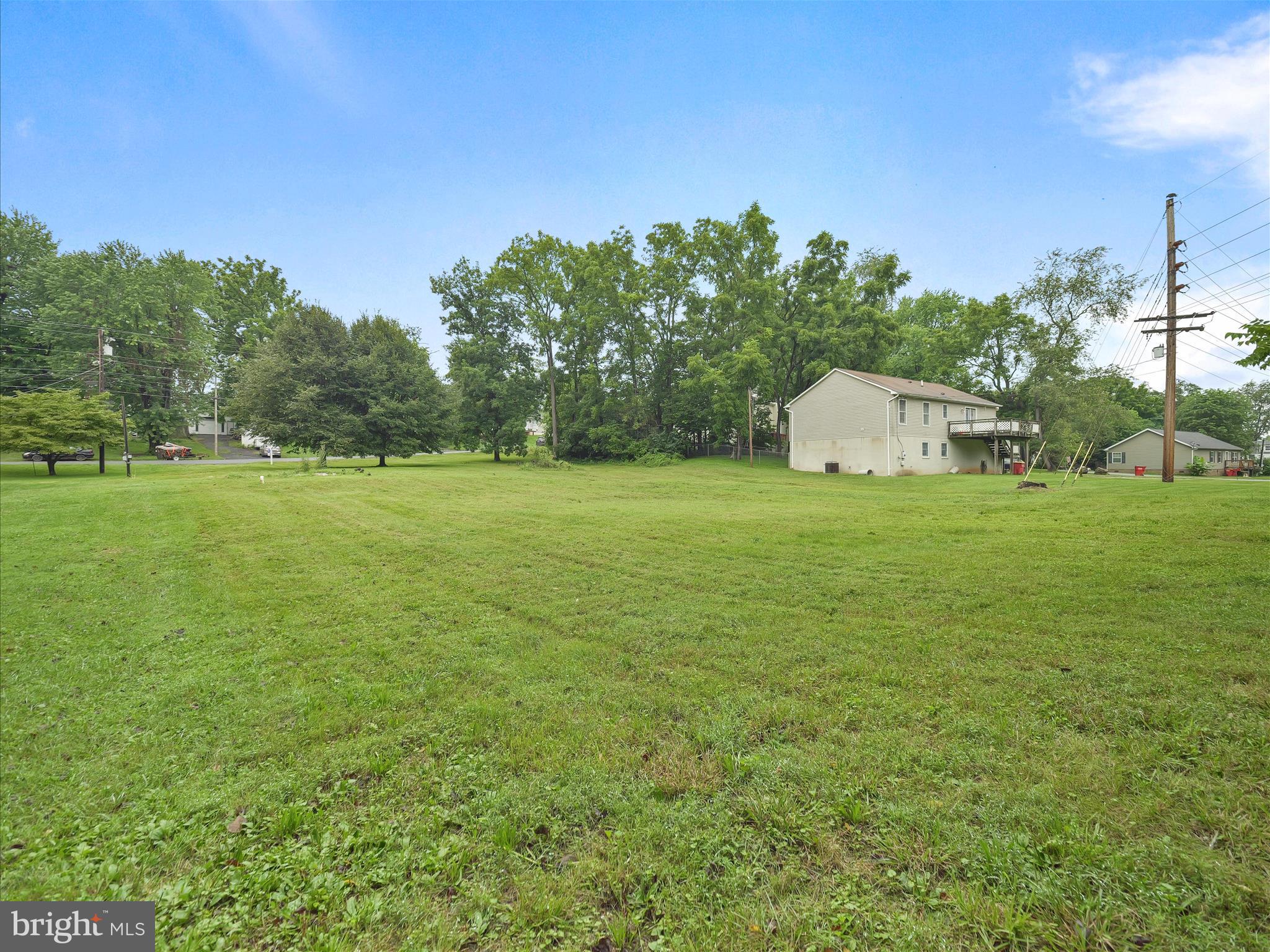 406 Burns Street Ranson, WV 25438 - Photo 32 of 32 a view of a big yard with a house