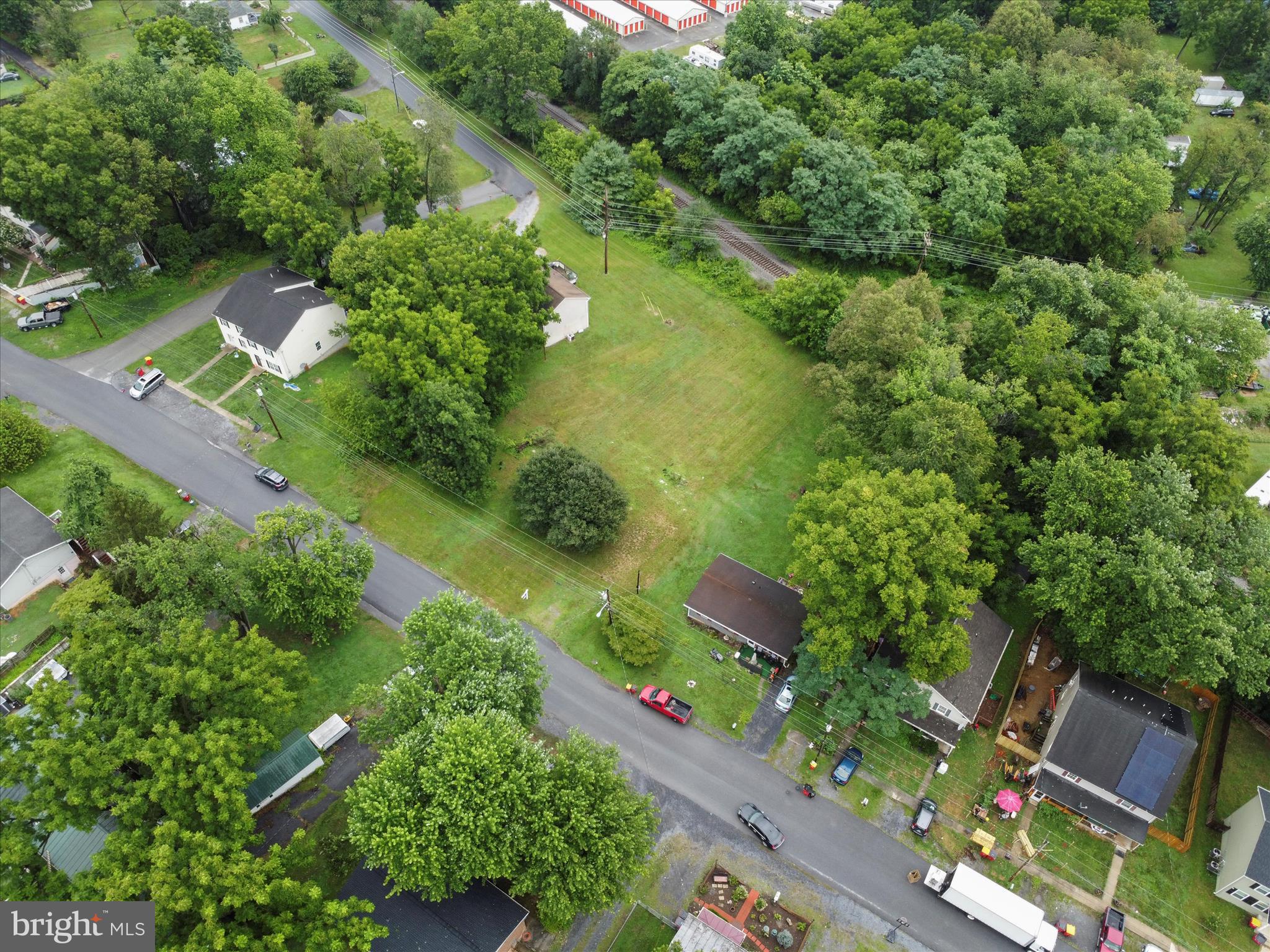 406 Burns Street Ranson, WV 25438 - Photo 9 of 32 an aerial view of green landscape with trees