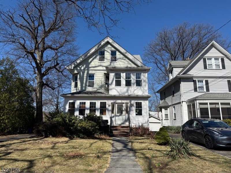 32 Montclair Avenue, Unit 1 Montclair, NJ 07042 - Photo 1 of 14 a front view of a house with yard and green space