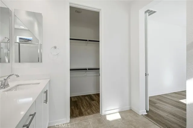 a bathroom with a sink and mirror