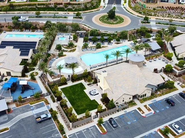 an aerial view of a house with garden space and street view