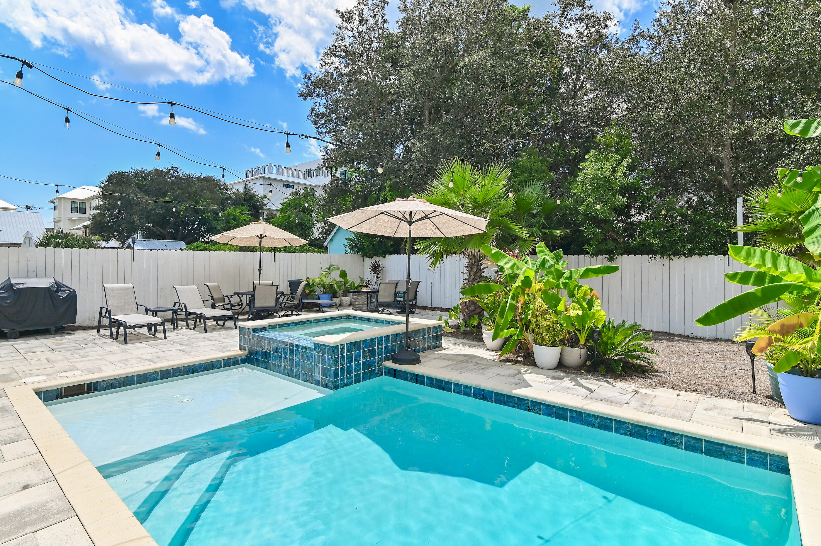 75 Pelayo Avenue Santa Rosa Beach, FL 32459 - Photo 11 of 67 a view of a swimming pool with chairs and plants