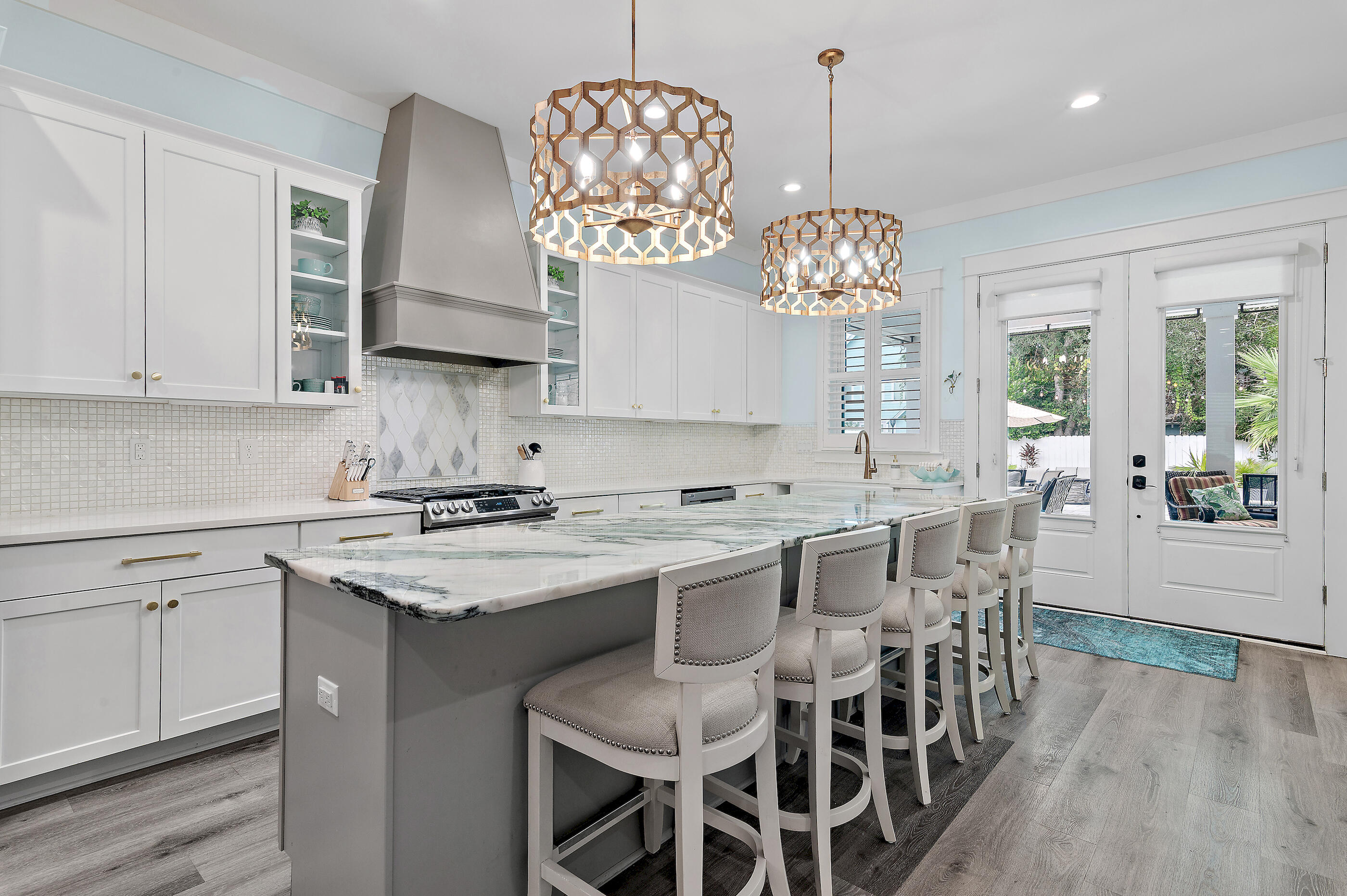 75 Pelayo Avenue Santa Rosa Beach, FL 32459 - Photo 22 of 67 a kitchen that has a lot of white cabinets and stainless steel appliances