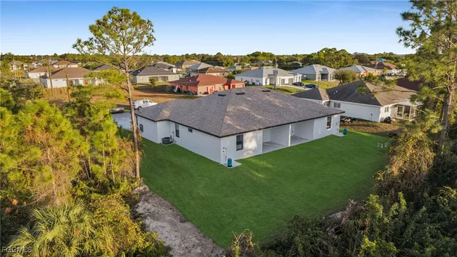 an aerial view of a house with a garden