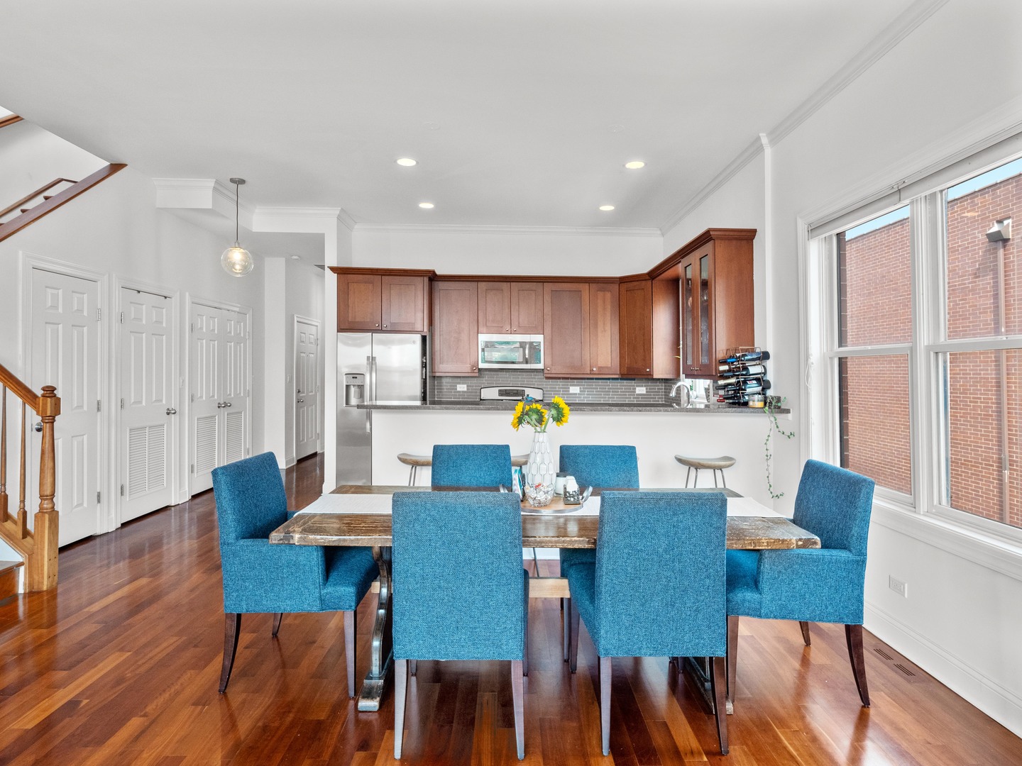 2940 North Sheffield Avenue, Unit 4N Chicago, IL 60657 - Photo 11 of 32 a view of a dining room with furniture and wooden floor