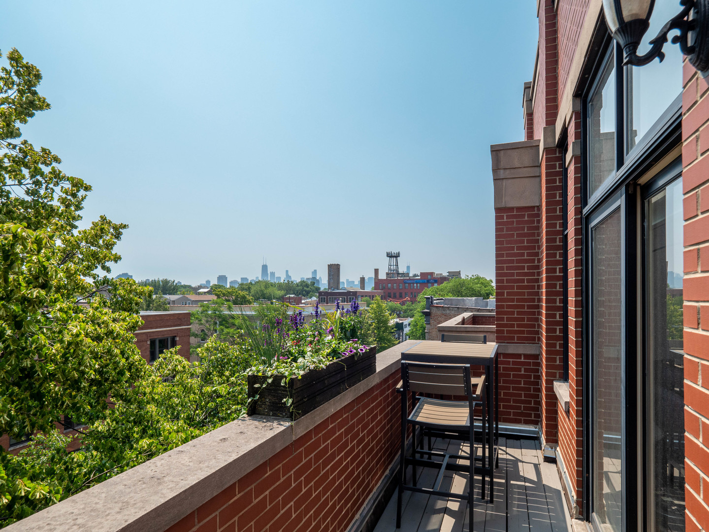 2940 North Sheffield Avenue, Unit 4N Chicago, IL 60657 - Photo 7 of 32 a view of balcony with wooden floor and outdoor seating