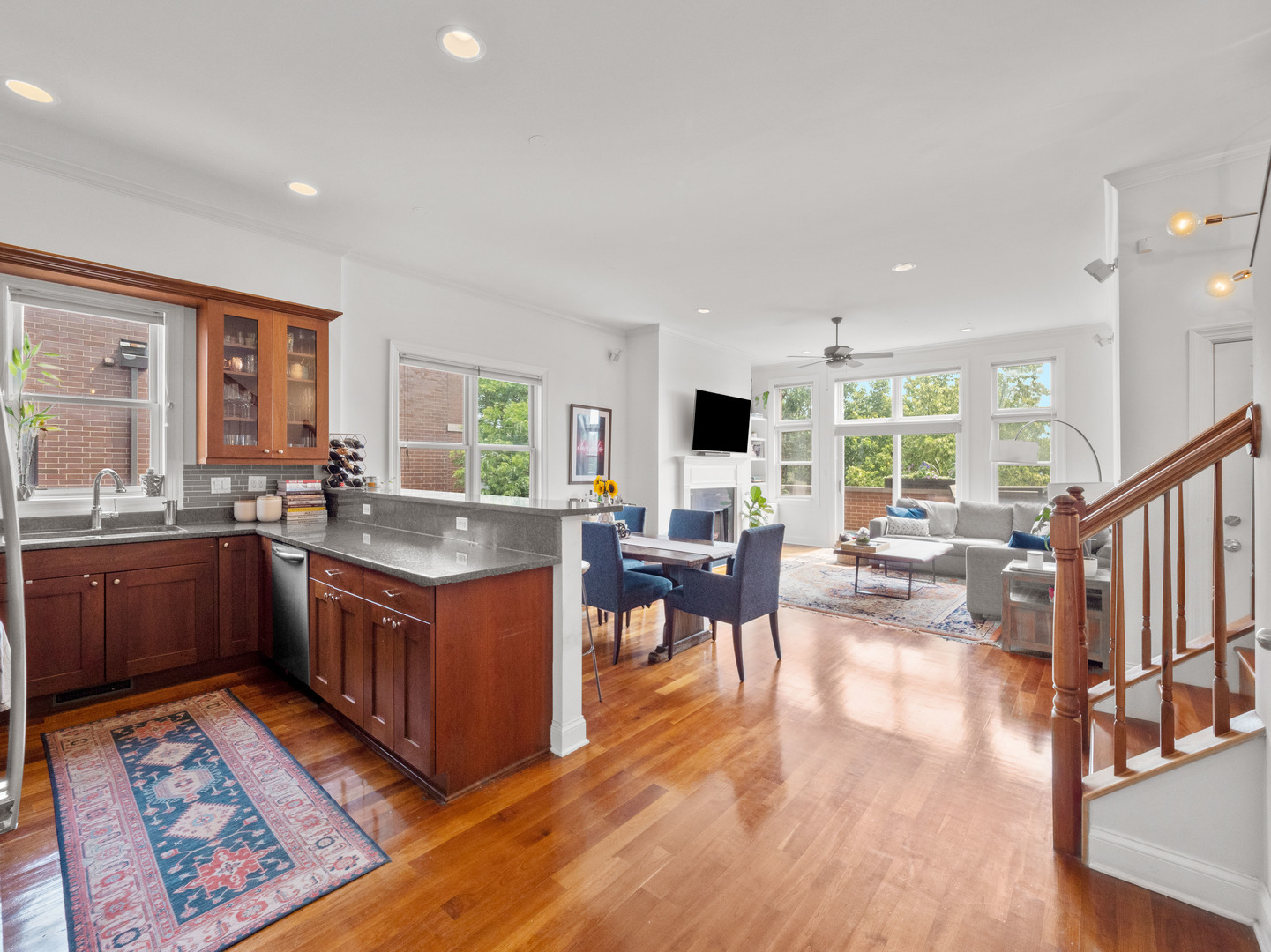2940 North Sheffield Avenue, Unit 4N Chicago, IL 60657 - Photo 8 of 32 a large living room with stainless steel appliances granite countertop a couch and a large window