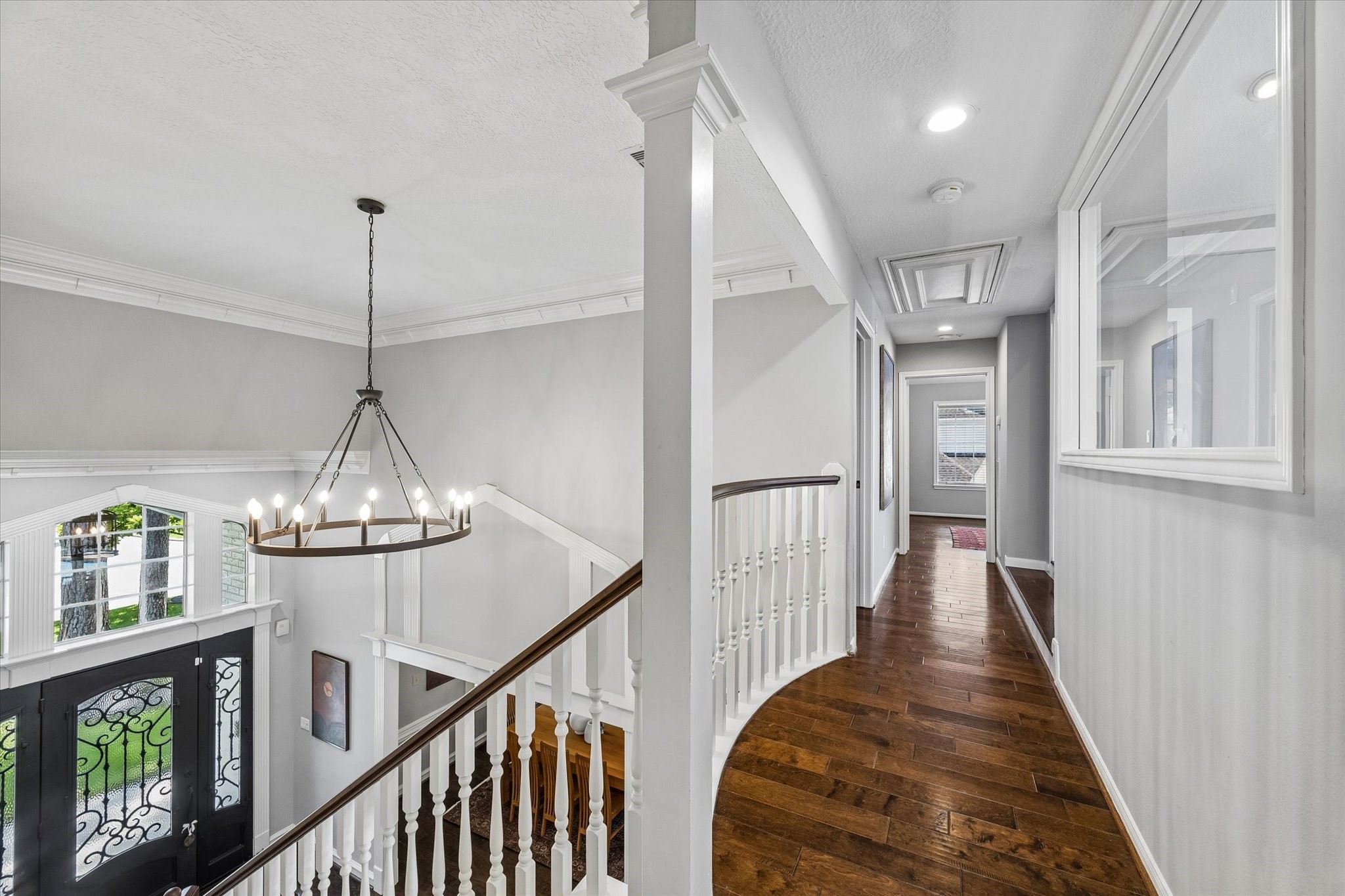 146 Golden Shadow Circle Spring, TX 77381 - Photo 25 of 41 The second level of this home is as architecturally pleasing as the main level, featuring graceful curved hallways, decorative columns, and an open overlook to the grand foyer below. Thoughtful millwork and abundant natural light enhance the character and elegance of this inviting space.