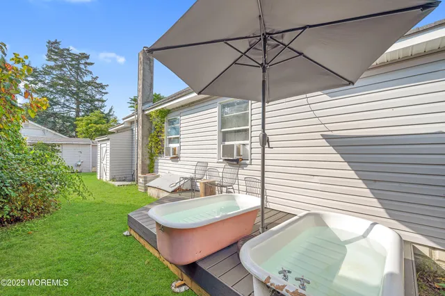 a backyard of a house with seating space