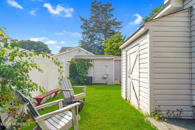 a view of backyard with a small cabin