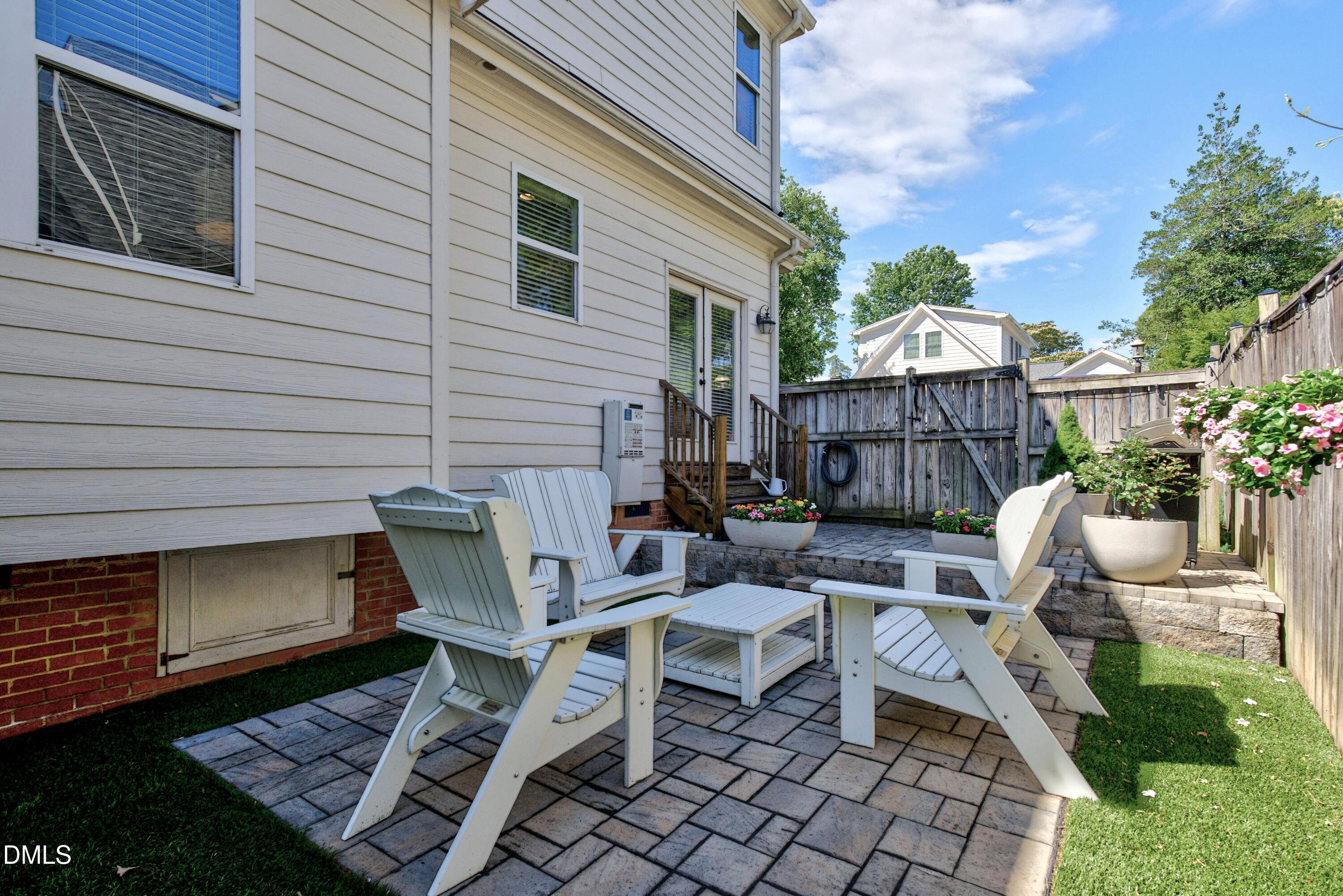 2745 Oberlin Road, Unit 103 Raleigh, NC 27608 - Photo 21 of 23 a view of a chairs and table in the back yard of the house