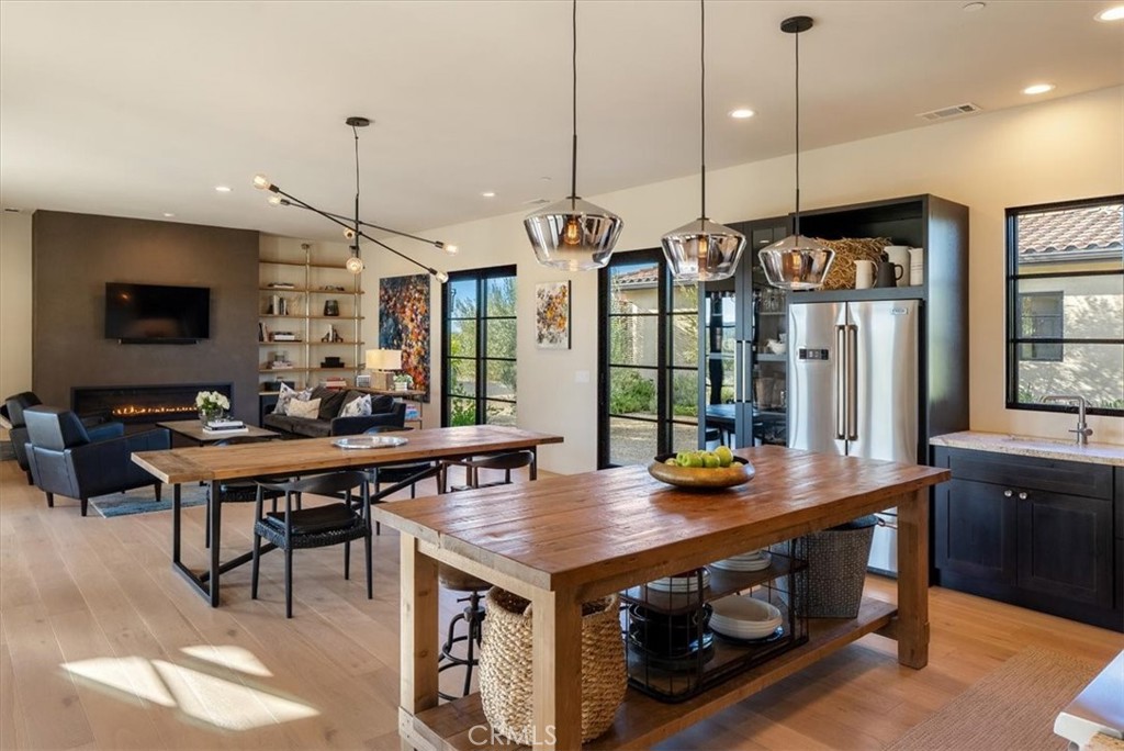 3940 Gruenhagen Flat Road Paso Robles, CA 93446 - Photo 11 of 63 a kitchen that has a table chairs and a wooden floor