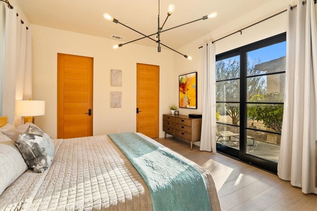 3940 Gruenhagen Flat Road Paso Robles, CA 93446 - Photo 20 of 63 a bedroom with a large bed and a large window