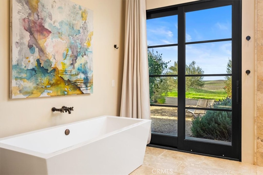 3940 Gruenhagen Flat Road Paso Robles, CA 93446 - Photo 21 of 63 a bathroom with a bathtub and a shower