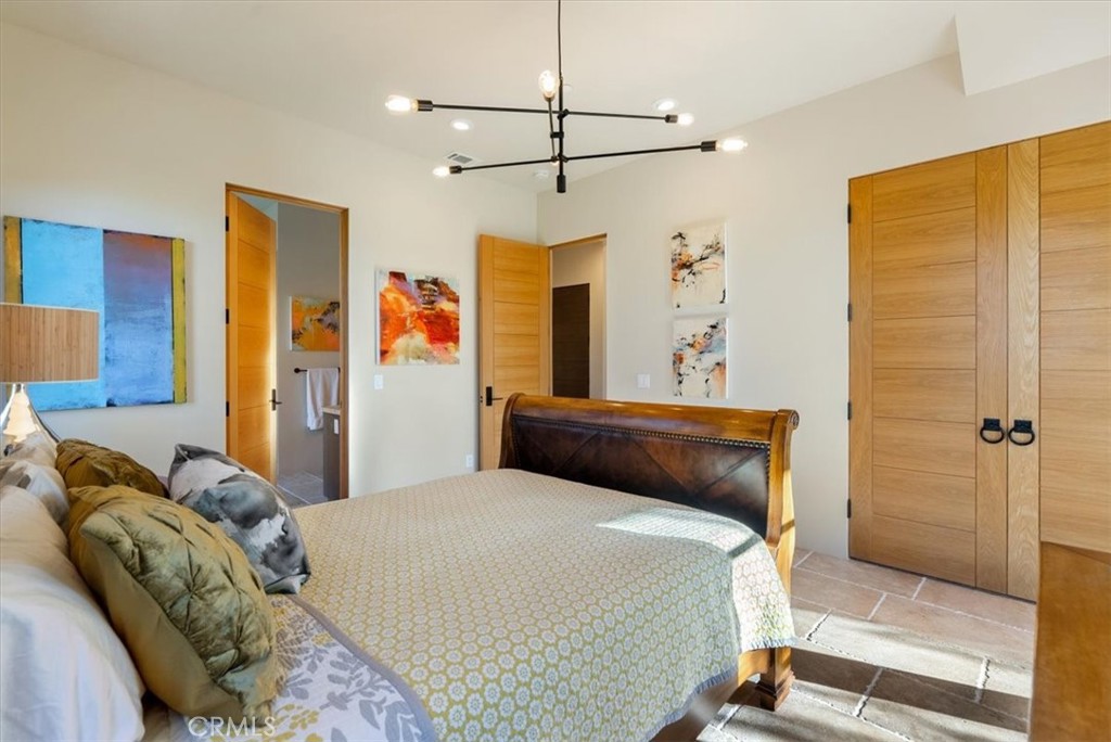 3940 Gruenhagen Flat Road Paso Robles, CA 93446 - Photo 25 of 63 a bedroom with a bed and a table