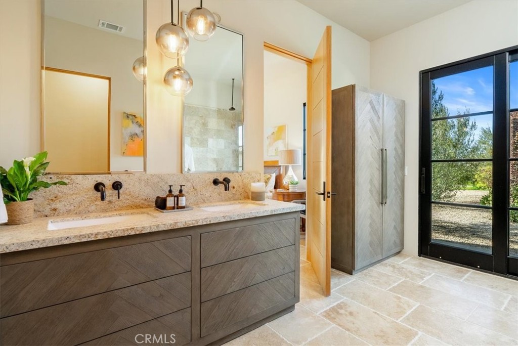 3940 Gruenhagen Flat Road Paso Robles, CA 93446 - Photo 26 of 63 a bathroom with a granite countertop sink mirror and double