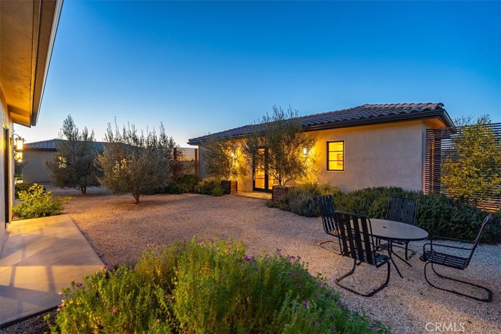 3940 Gruenhagen Flat Road Paso Robles, CA 93446 - Photo 32 of 63 a backyard of a house with table and chairs