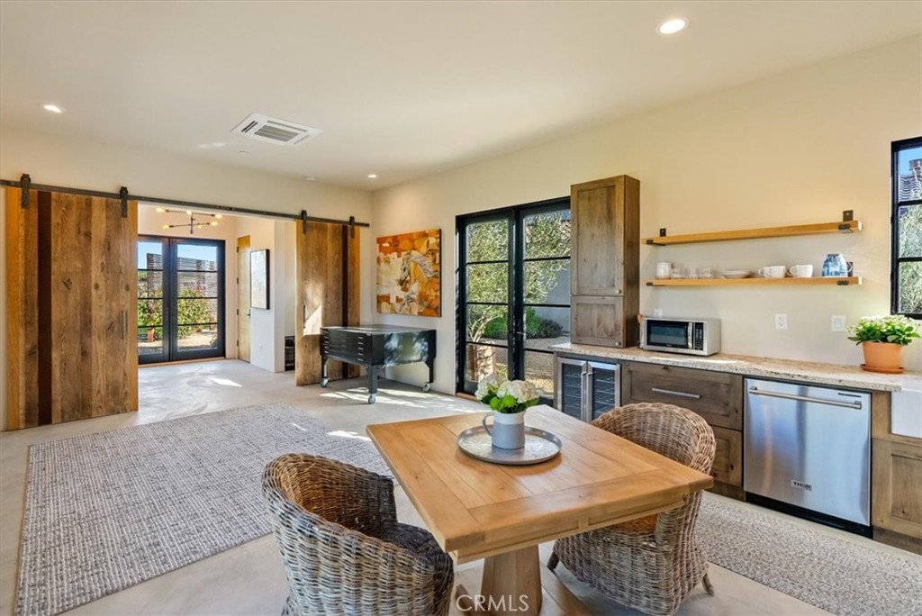 3940 Gruenhagen Flat Road Paso Robles, CA 93446 - Photo 33 of 63 a dining room with furniture a window and kitchen view