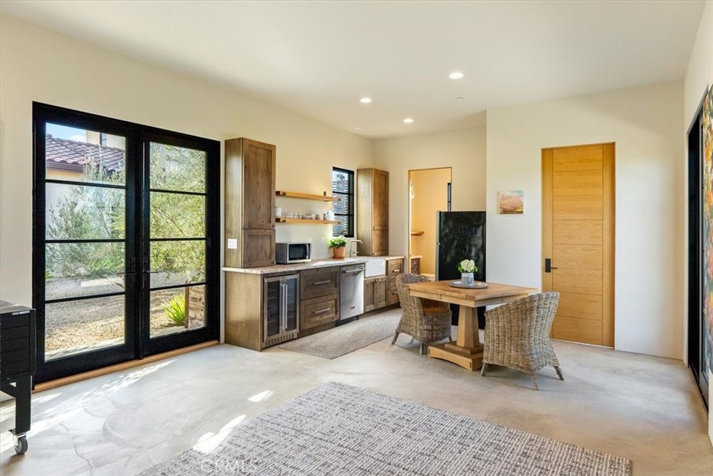 3940 Gruenhagen Flat Road Paso Robles, CA 93446 - Photo 37 of 63 a view of a living room filled with furniture and large windows