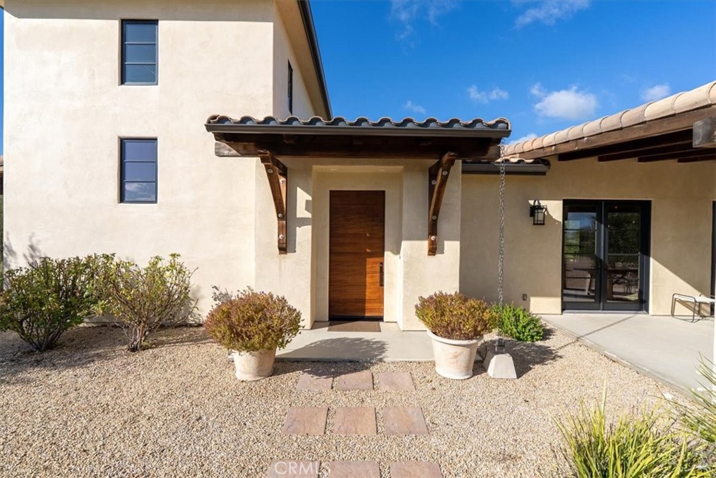 3940 Gruenhagen Flat Road Paso Robles, CA 93446 - Photo 4 of 63 a view of a front of a house with potted plants