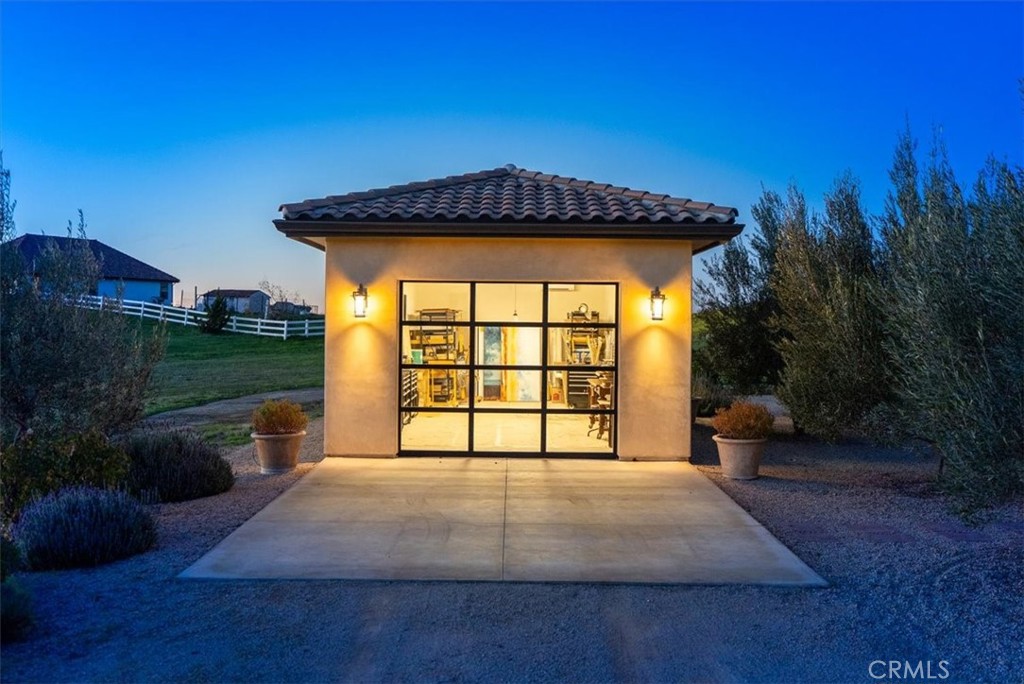 3940 Gruenhagen Flat Road Paso Robles, CA 93446 - Photo 49 of 63 a front view of a house with a yard