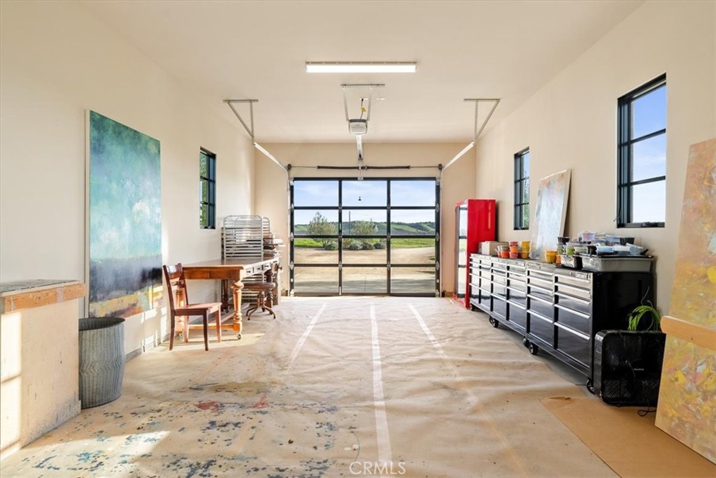 3940 Gruenhagen Flat Road Paso Robles, CA 93446 - Photo 51 of 63 a bed room with furniture and large windows