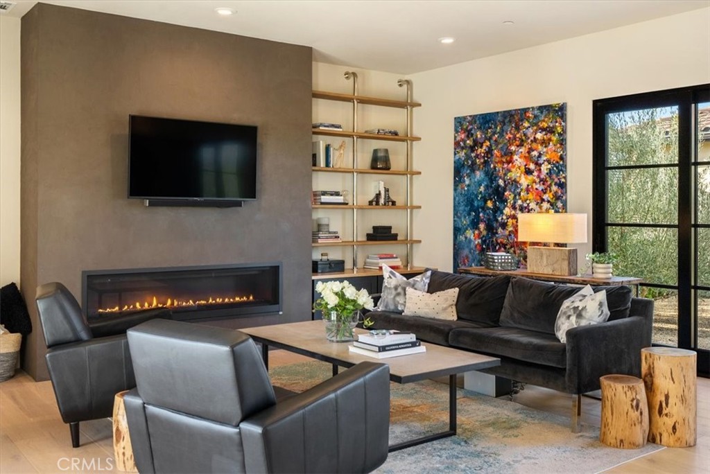 3940 Gruenhagen Flat Road Paso Robles, CA 93446 - Photo 9 of 63 a living room with furniture a flat screen tv and a fireplace