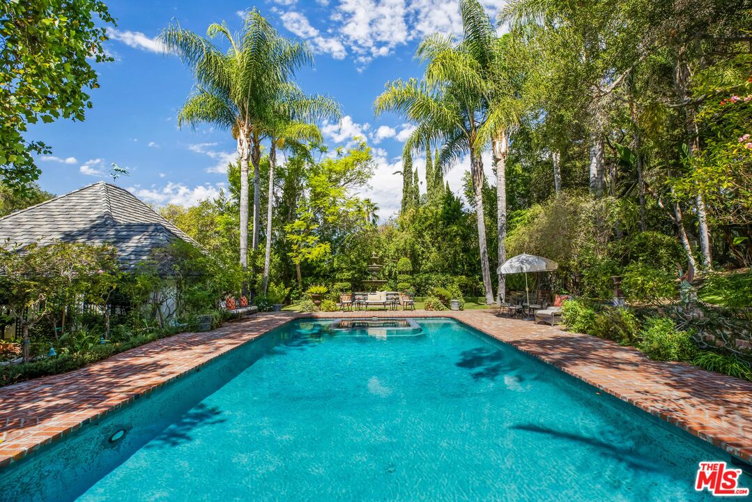 3240 Fryman Road Studio City, CA 91604 - Photo 7 of 11 a view of yard with swimming pool and green space