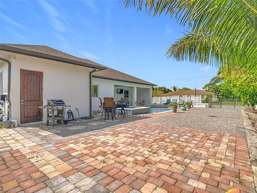 1806 41st Street Southwest Naples, FL 34116 - Photo 2 of 27 a view of a backyard with a patio