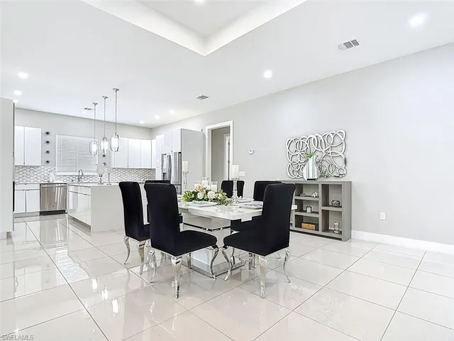 a view of kitchen with cabinets and outdoor space