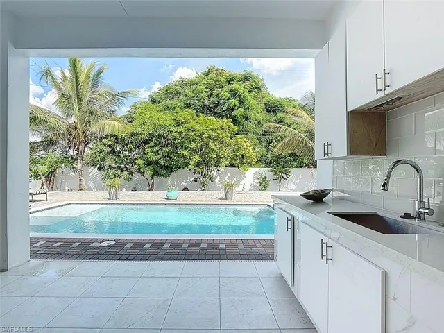 a kitchen with a sink and cabinets