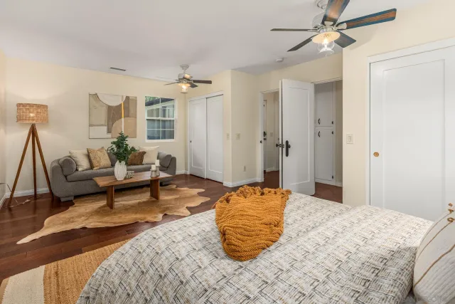 a bedroom with a bed and a couch