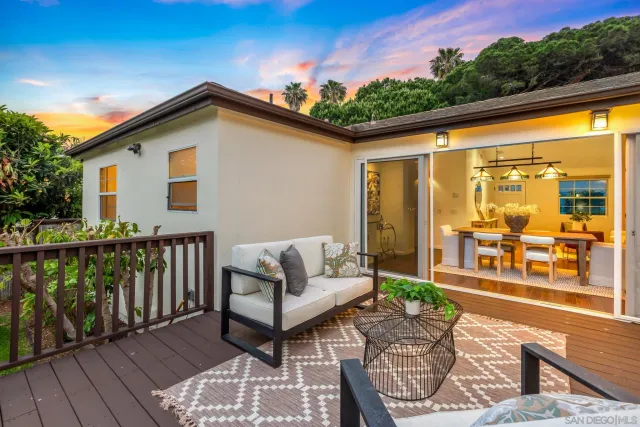 a view of two chairs in the balcony