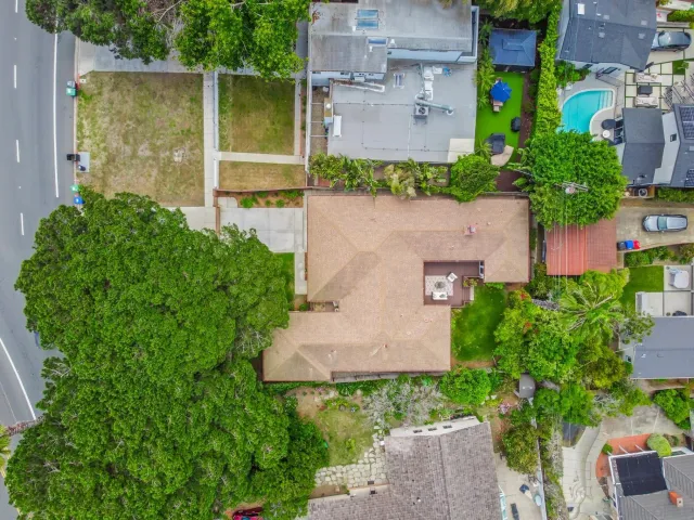 an aerial view of a house with a garden