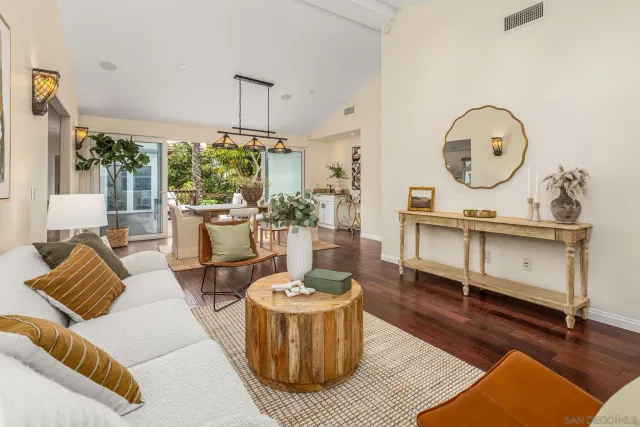 a living room with furniture a window and a table