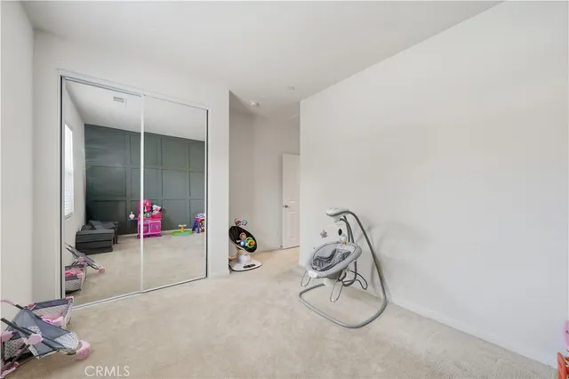 a bed room with a bed and a window