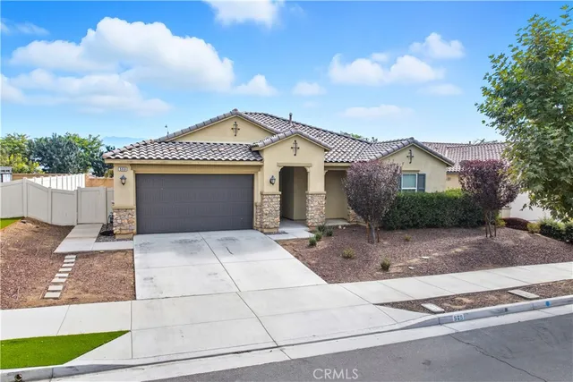 a front view of a house with a garage
