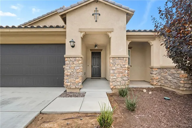 an aerial view of a house with a garden