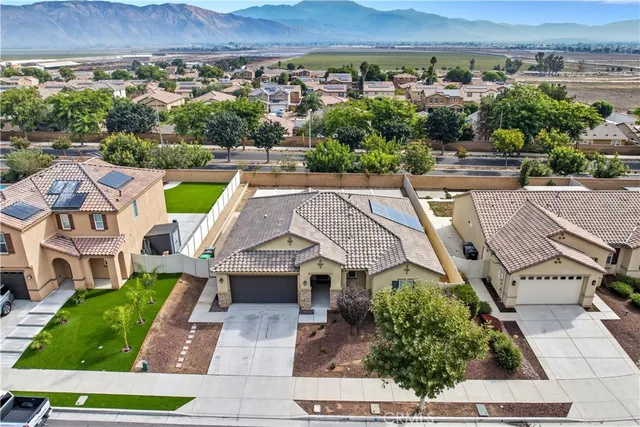 an aerial view of a house with a garden