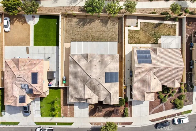 an aerial view of residential houses with outdoor space