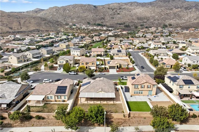 an aerial view of a house with a garden potted plants