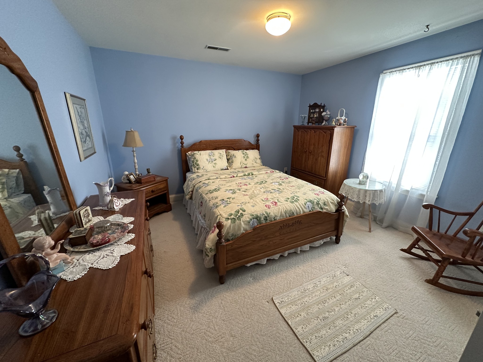 1817 Devon Drive Spring Hill, TN 37174 - Photo 15 of 28 a bedroom with a bed a couch and a large window