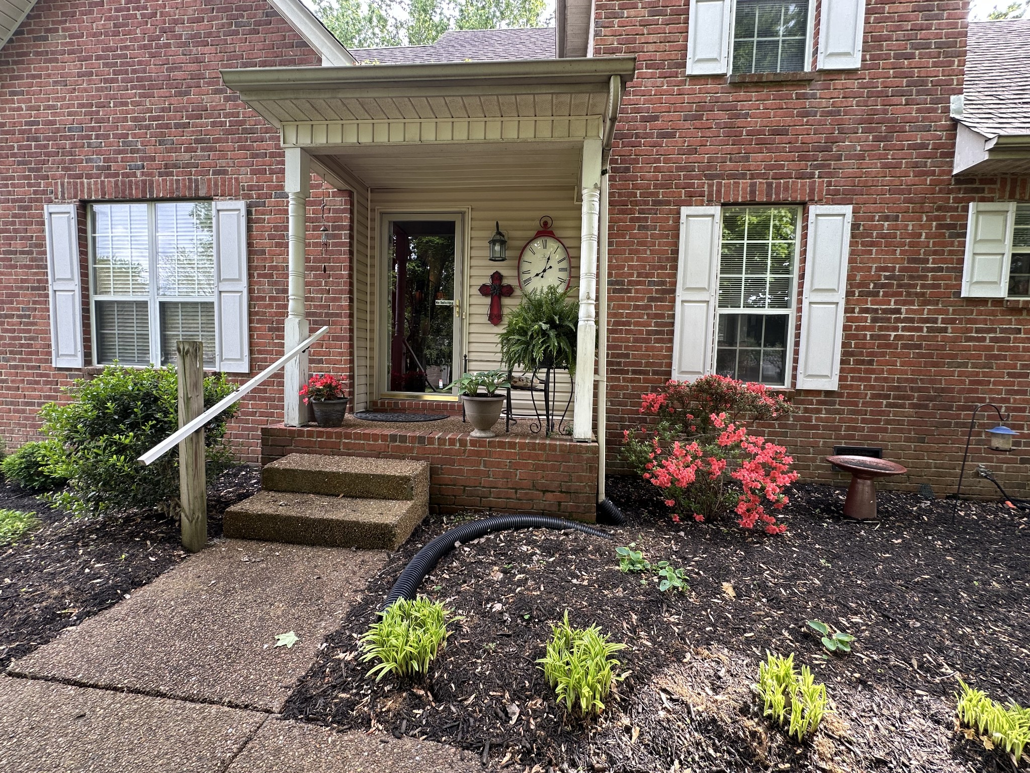 1817 Devon Drive Spring Hill, TN 37174 - Photo 24 of 28 a front view of a house with a garden