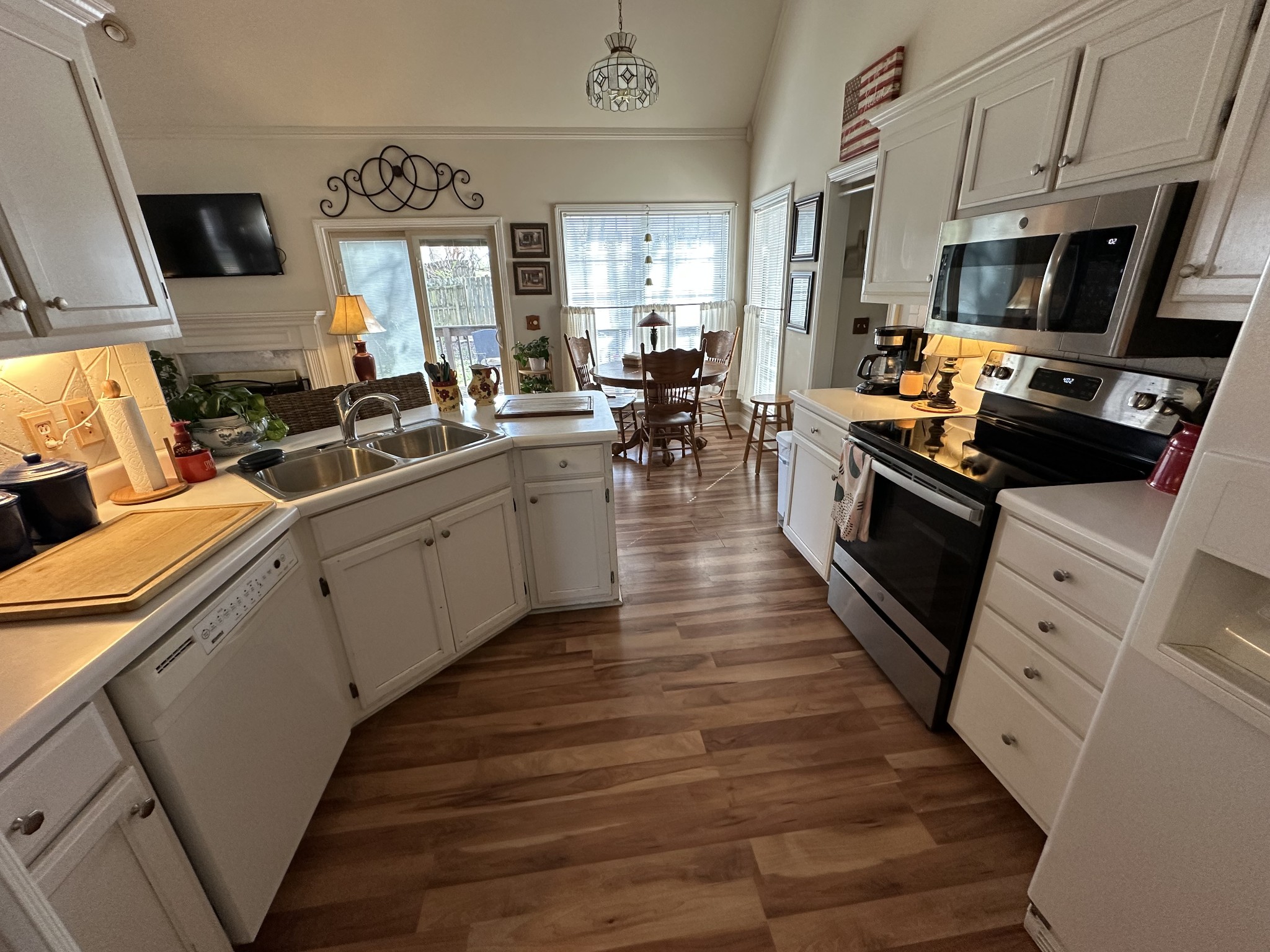 1817 Devon Drive Spring Hill, TN 37174 - Photo 8 of 28 a large kitchen with stainless steel appliances granite countertop a lot of counter space and wooden floors