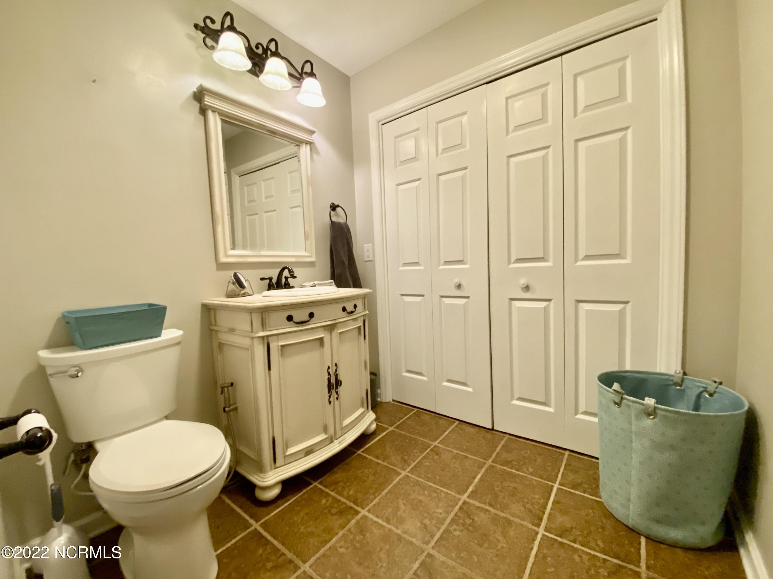 179 East V Hogan Drive Rockingham, NC 28379 - Photo 12 of 33 Hall Bath, Washer and Dryer behind double doors