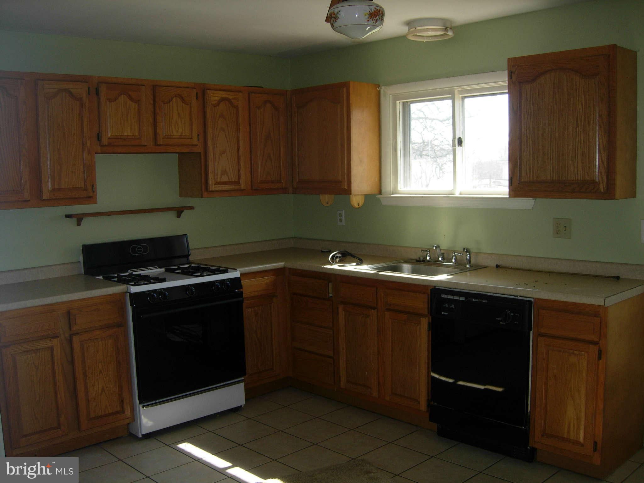58 Elkmore Road Elkton, MD 21921 - Photo 8 of 8 Kitchen, lots of cabinets and entrance to deck!