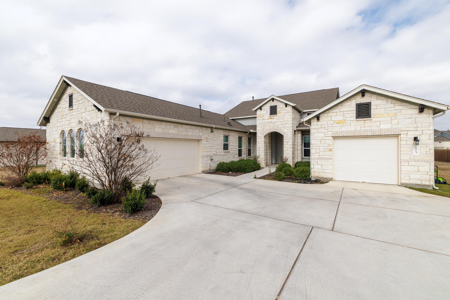 1913 Equine Road Leander, TX 78641 - Photo 1 of 35 a front view of a house with a yard and garage