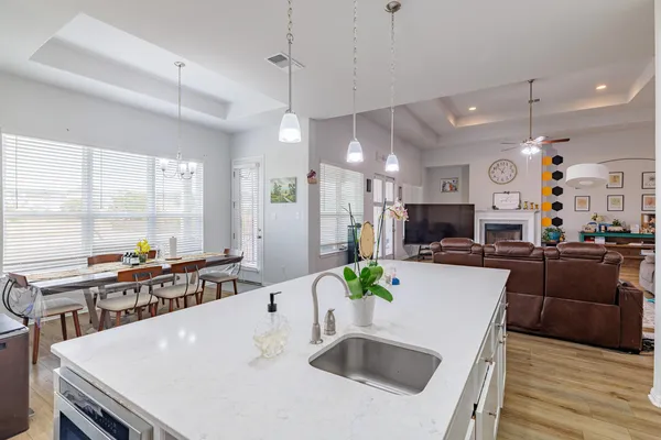 a large kitchen with a table and chairs